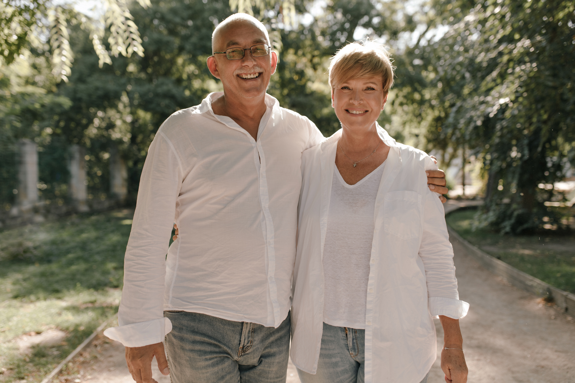 Happy older couple laughing together while sharing a meal