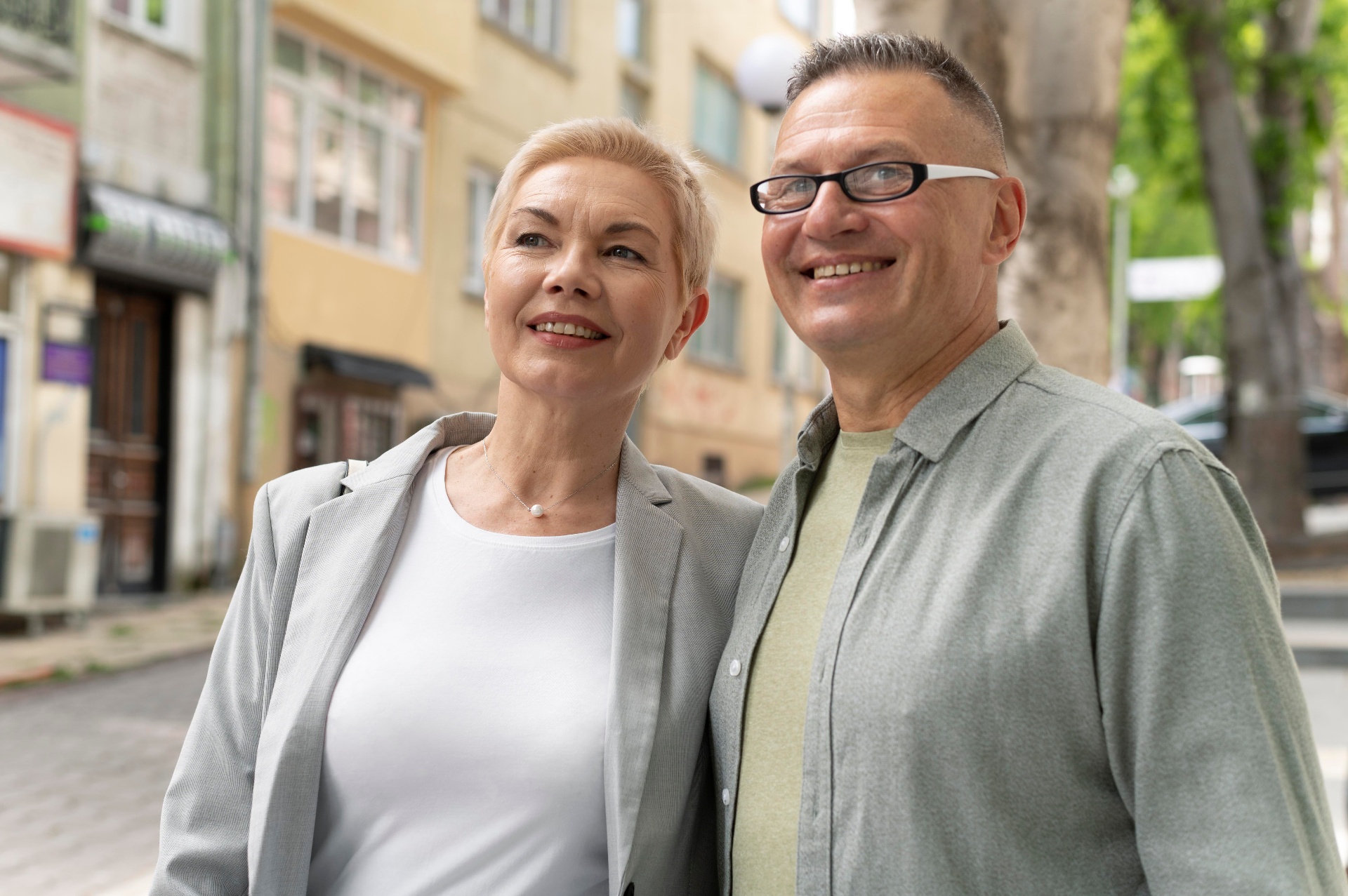 Confident older adult smiling while sharing a meal with family